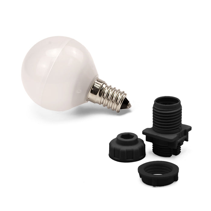 White light bulb with E14 base and black socket and cap on a white background